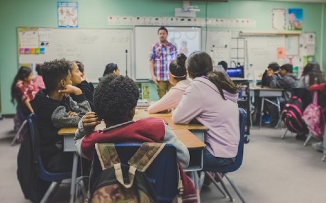 teacher in front of a class of students